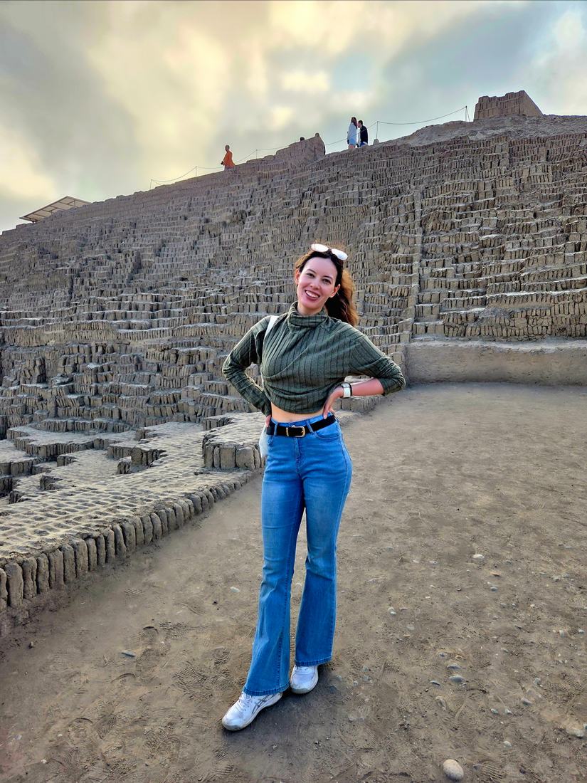 Standing in front of the adobe pyramids at Lima, Peru